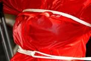 Katharina tied and gagged in shiny nylon rainwear