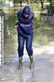 Stella bound outdoor in a blue rainsuit