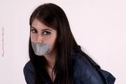 Shelly bound and gagged in shiny nylon rainwear
