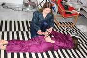 Watching sexy Alina being tied and gagged on the floor from Katharina both wearing sexy shiny nylon rainwear combinations (Pics)