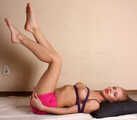 Barefoot topless Samira, tied with hemp rope, poses for the camera