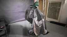 Marie M. taped and gagged in shiny nylon rainwear