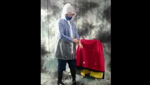 Nadja posing in layers of raingear part 2