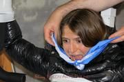 Katharina tied and gagged in a shiny nylon downcoat and shiny nylon pants