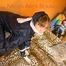 Leoni tied and gagged on a sofa wearing a sexy shiny nylon pants and a rain jacket (Pics)