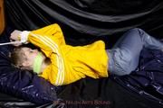 Samanthy bound and gagged in shiny nylon rainwear