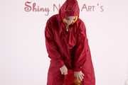 Watching sexy Jill wearing a sexy yellow shiny nylon rainwearcombination and a red shiny nylon raincoat posing for you (Pics)