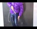 Get an Archive Video with Mara enjoying a shower with her shiny nylon downjacket