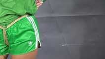 Alice bound and gagged in shiny nylon Shorts and Rainjacket