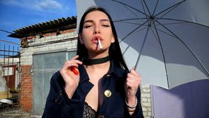 Attractive Lera taking a smoke break outside