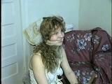 19 Yr OLD SINGLE MOM RONI IS WRAP CLEAVE GAGGED WITH AN ACE BANDAGE, HANDGAGGED, MOUTH STUFFED, BALL-GAGGED & TIED BACKWARDS TO A CHAIR (D53-9)