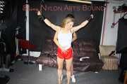 Watching Sandra being tied and gagged overhead with ropes and a clothgag from sexy Stella both wearing sexy shiny nylon shorts and tops (Pics)