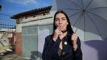 Attractive Lera taking a smoke break outside