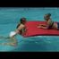 Katharina and Jenny swimming in an indoor pool wearing sexy shiny nylon shorts and bikini-tops (Video)