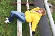 Leonie tied and gagged outdoor wearing a shiny yellow downjacket (Pics)