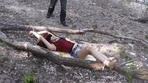 Nelly tied between two trees 1/2