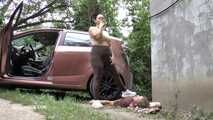Mistress Jenna stands on the slave with a car while smoking in the slave's mouth A