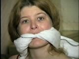 ONE IS STOCKING GAGGED, WET WRISTS GAGGED, BAREFOOT, TOE-TIED, GAGS HERSELF & IS HANDGAGGED (D43-12)