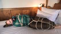 Rachel Adams tied and gagged in shiny Downwear