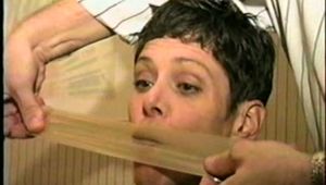 47 Yr OLD UNCOOPERATIVE LATINA HAIR DRESSER IS WRAP TAPE GAGGED & BALL-TIED ON THE BED (D47-11)