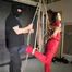 Marie bound, gagged and suspended in a shiny nylon Jumpsuit