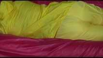 Watching Mara putting on sexy yellow shiny nylon rainwear lolling on the sofa (Video)