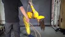 Marie tied and gagged in shiny nylon rainwear
