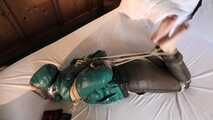 Rachel Adams tied and gagged in shiny Downwear