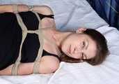 Sally is hogtied