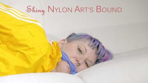SEXY MARA being tied and gagged on the ceiling with ropes wearing a hot blue shiny nylon shorts and a yellow rain jacket (Pics)