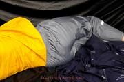Samanthy bound and gagged in shiny nylon rainwear