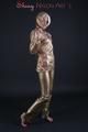 Blonde archive girl posing in a studio wearing a sexy golden rainwear combination (Pics)