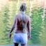 Jenny sunbathing on a lake and go swimming wearing sexy shiny nylon shorts and a bikini-top (Pics)