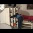 Archive girl chilling in her flat wearing sexy shiny nylon rainwear (Video)