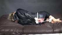 Watching Pia being tied and gagged with ropes and a clothgag wearing sex black shiny nylon suit (Video)