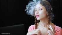 Watch the beauty with crystal blue eyes smoking a 120mm cigarette in her fresh video