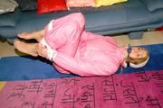 Katharina tied and gagged in shiny nylon ski suit