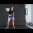 Archive girl posing with a soccer ball wearing a sexy blue shiny nylon shorts and a top (Video)