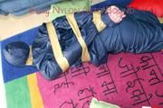 Jill tied, gagged and hooded on the floor with tape wearing an oldschool rain combination (Pics)