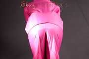 Mara wearing a sexy pink rainsuit posing infront of the camera in a studio (Pics)