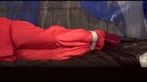 Jill tied, gagged and hooded on a princess bed wearing shiny orange rainwear (Video)