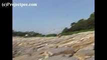 016169 Eve Takes A Discrete Pee On The Rocks