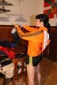 Jill wearing a sexy black nylon shorts and a orange rain jacket while dressing her up (Pics)