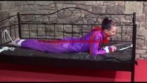 Mara tied and gagged on a princess bed in an old cellar wearing a sexy purple rainwear combination (Video)
