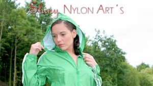 Enni having a good time outdoor wearing sexy shiny nylon shorts and a top posing for the camera (Pics)