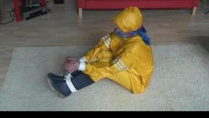 03:20 Min. video with Katharina bound in a yellow rainsuit