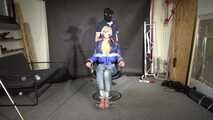 Alice bound and gagged in a shiny nylon Downjacket