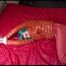 Mara tied and gagged on bed wearing a sexy orange shiny down jacket and a orange rain pants (Video)