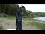 Enni wearing shiny nylon shorts and a rain jacket as well as a rain pants over the shorts (Video)