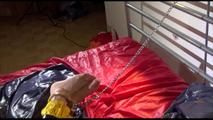Sonja tied, gagged and hooded on bed with tape wearing a supersexy yellow rainwear combination (Video)
